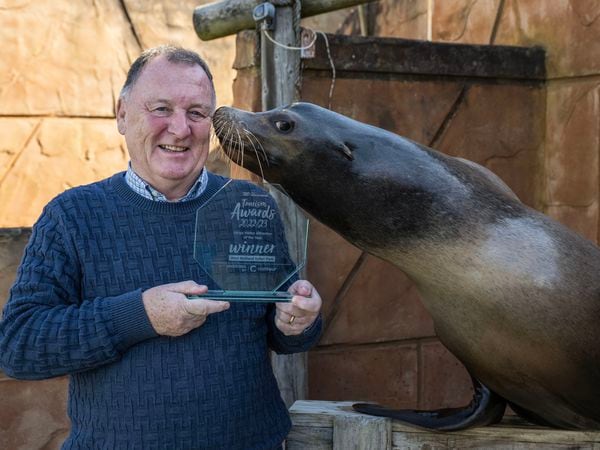 Managing Director Chris Kelly celebrates the success with one of the sea lions. Photo: Matthew Lissimore