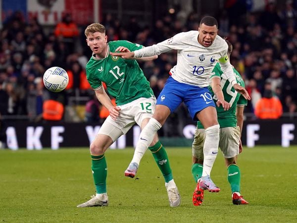 Republic of Ireland's Nathan Collins  and France's Kylian Mbappe battle for the ball 