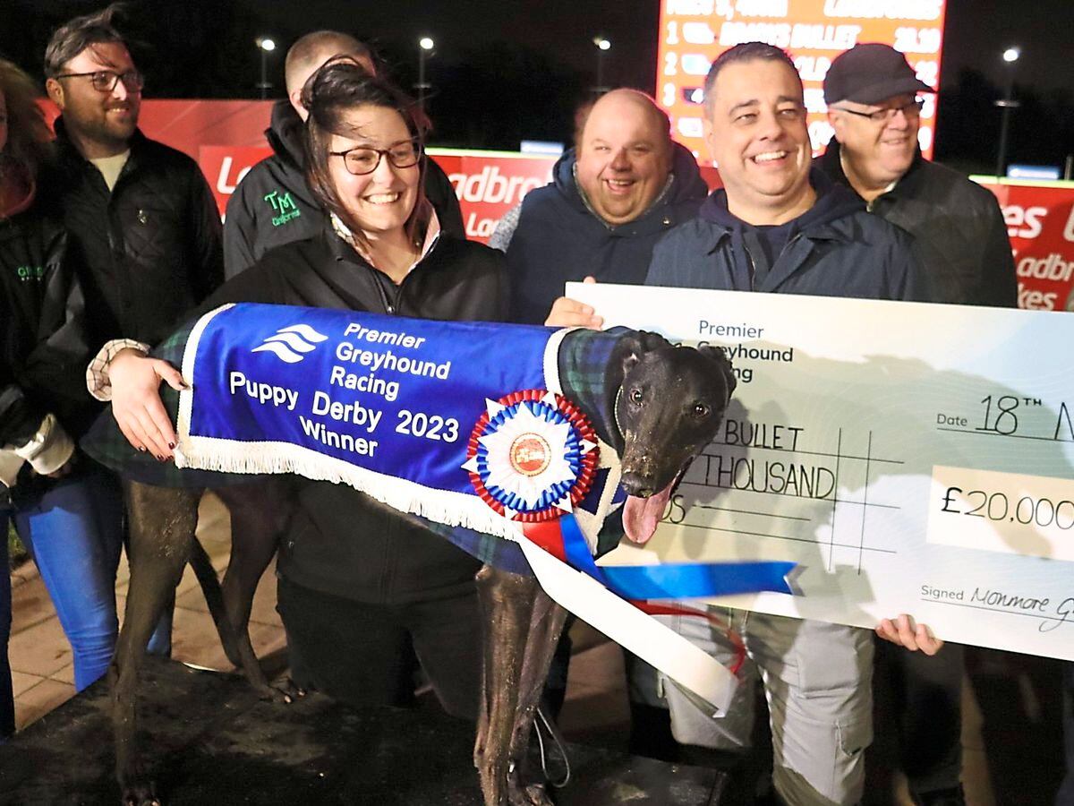Bradys Bullet, trained by Hove’s Belinda Green, with the £20,000 Puppy Derby winner cheque