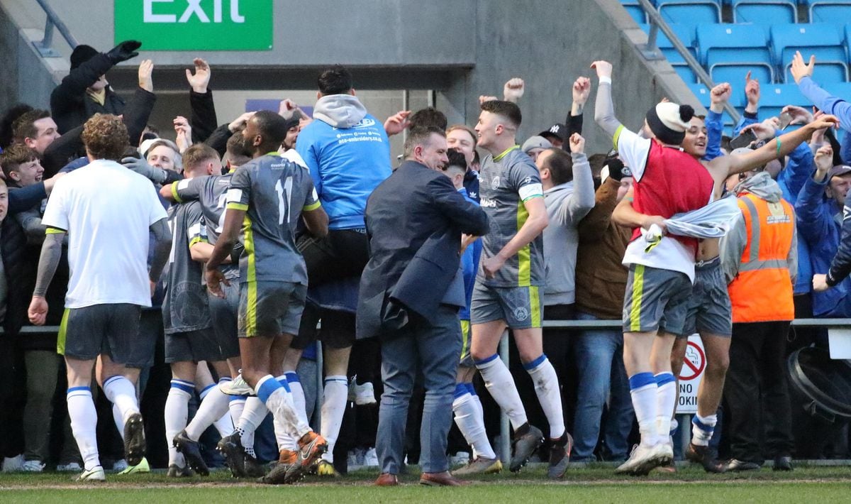 Halesowen Town celebrate their famous win at Halifax with hundreds of fans who made the trip on Saturday (Picture by Steve Evans)