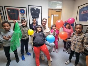 Councillor Christopher Burden (Cabinet Member for Children and Young People) and Maya Patel (#YES Youth Inspector), with children attending the STRiVE Plus provision, a provision for SEND children, held at The Hilda Hayward swimming pool at The Royal School, over May half-term.