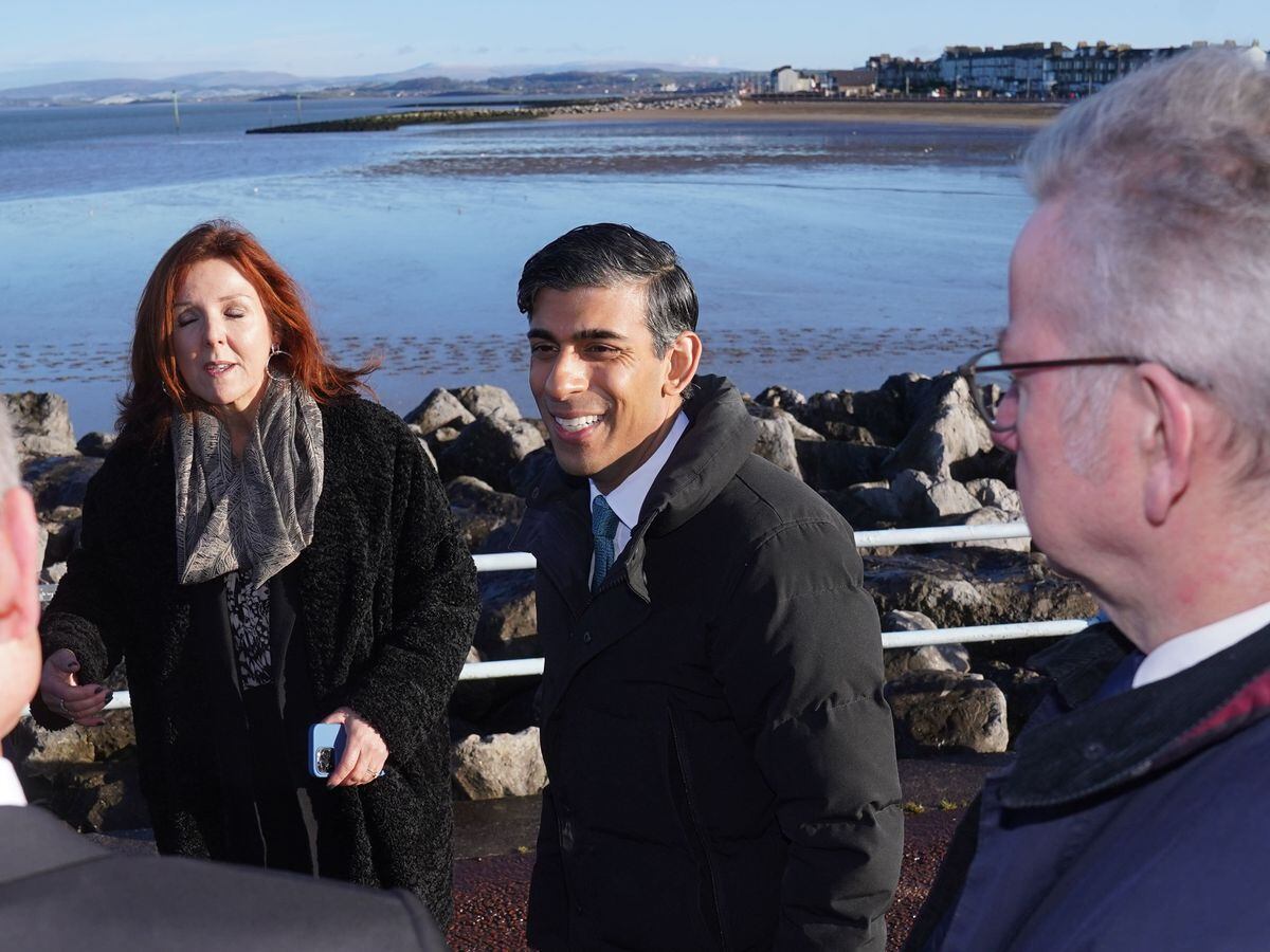 Prime Minister Rishi Sunak, centre, and Minister for Levelling Up, Housing and Communities Michael Gove during a visit to Morecambe, Lancashire