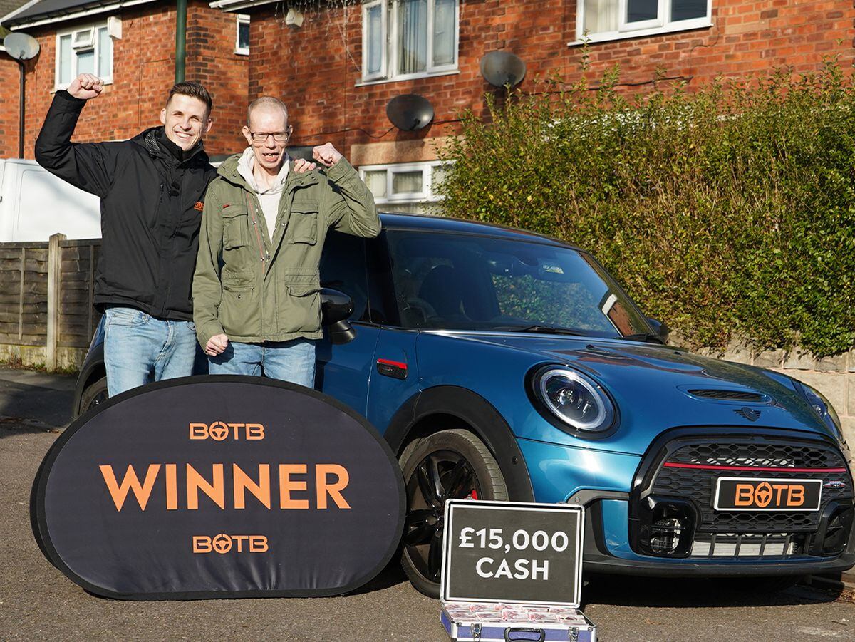Graham Palmer, from Walsall, pictured with his winnings along with Sean Hall, presenter for BOTB