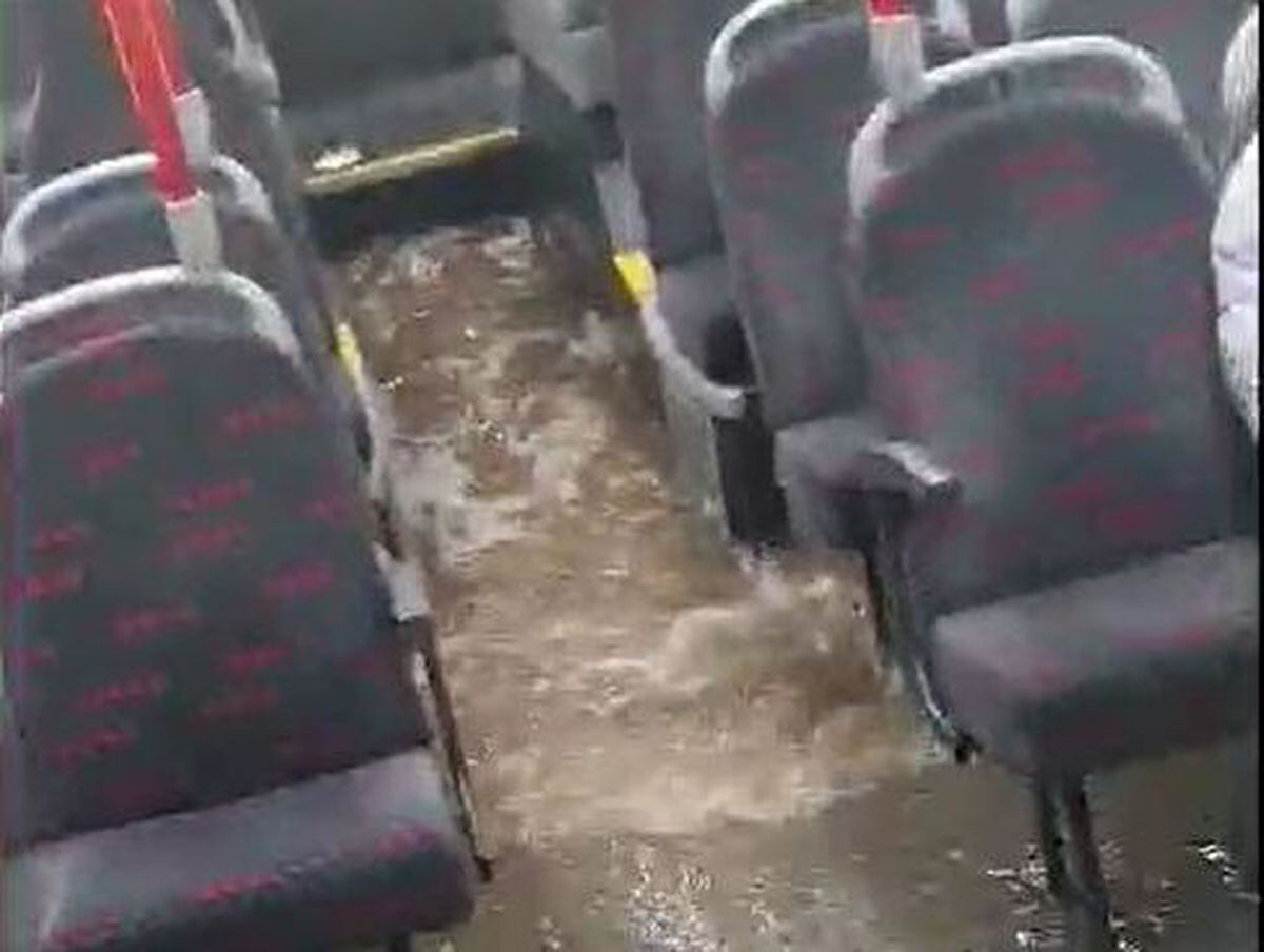 Water sloshing around the bus after the driver went into a flooded road