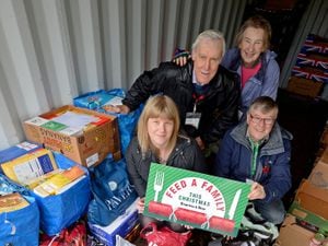 CANNOCK COPYRIGHT EXPRESS&STAR TIM THURSFIELD 05/11/19.Heather Large with David Clarke, chairman of Lichfield Food Bank, who have donated a large amount of food for the Express & Star's Feed A Family initiative. Also pictured are Christina and Richard Mallender from the food bank...