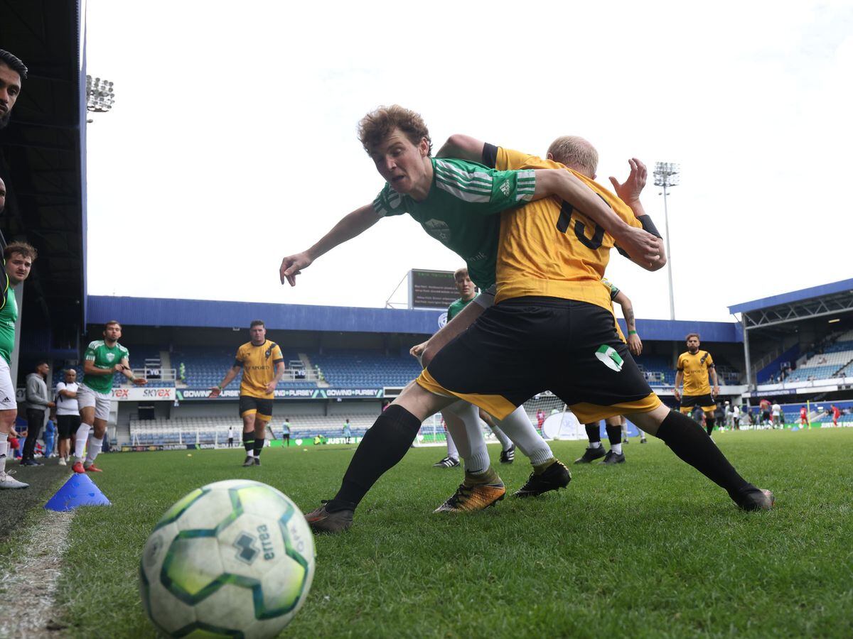 AFC South London player Theo Cox (left), tackles during a match against Westbourne United at the Grenfell Memorial Cup