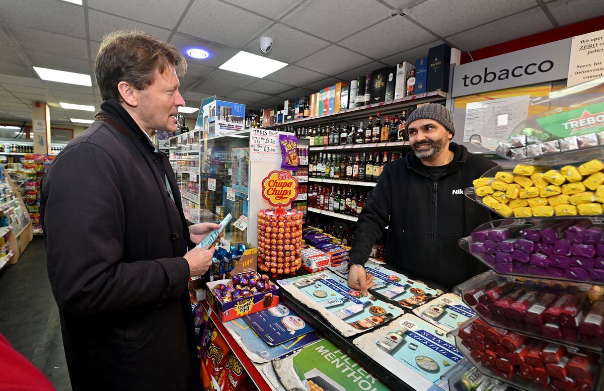 Reform UK leader Richard Tice visits Bloxwich High Street. Pictured chatting to shop owner Raj Bhandal