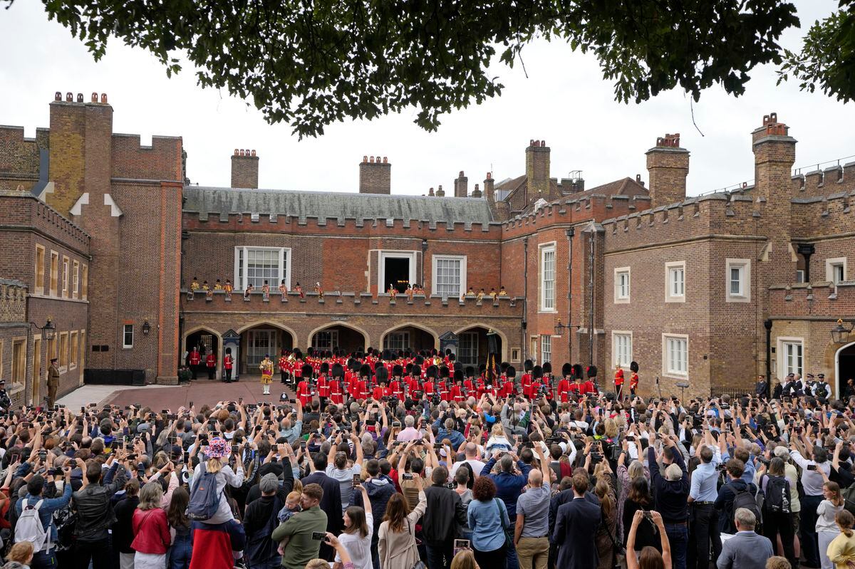 Members of the public look on after Garter Principle King of Arms, David Vines White read the proclamation of new King, King Charles III, from the Friary Court balcony of St James's Palace. Photo: Kirsty Wigglesworth/PA Wire