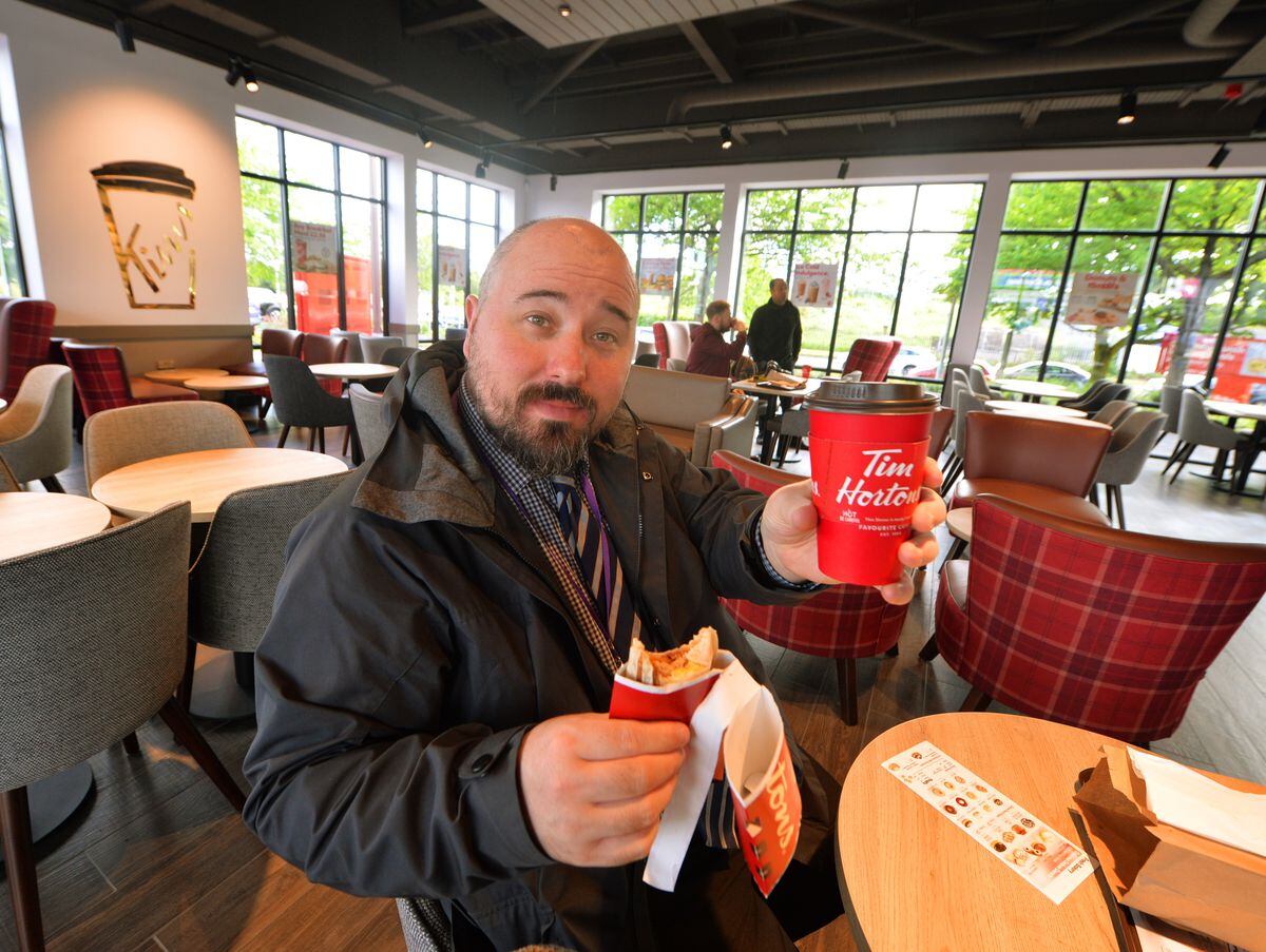 Express and Star reporter James Vukmirovic enjoys a breakfast wrap and dark roast coffee at the new Tim Hortons in Oldbury