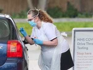 Photo taken at 10.38 shows tests being carried out at a coronavirus testing site in a car park at Chessington World of Adventures, in Greater London, as the UK continues in lockdown to help curb the spread of the coronavirus. PA Photo. Picture date: Friday April 3, 2020. See PA story HEALTH Coronavirus. Photo credit should read: Jonathan Brady/PA Wire.