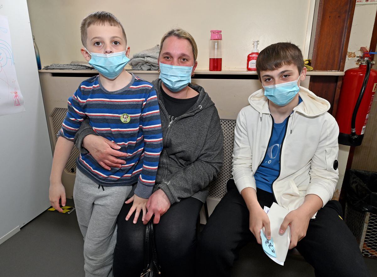 Lisa Firth with children Tyler and Lewis. Tyler was getting his first jab and Lewis his second