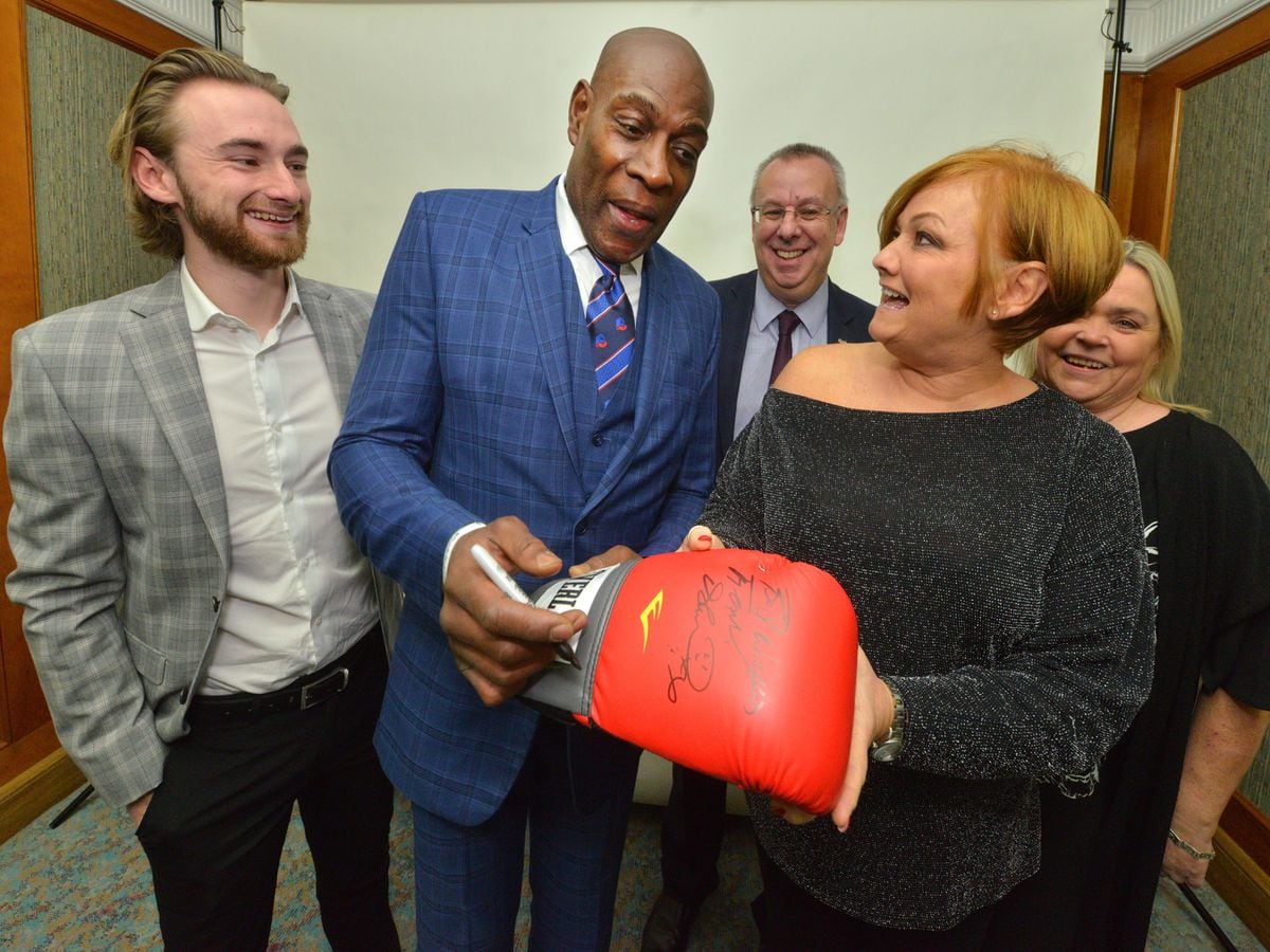 Frank Bruno and Steve Saul from Route 39 organised for a signed glove to be donated to the Smile For Joel charity. Frank is seen signing the glove with Suzy Evans and her son Owen Richards, along with Steve Saul and Karen Turner from the charity