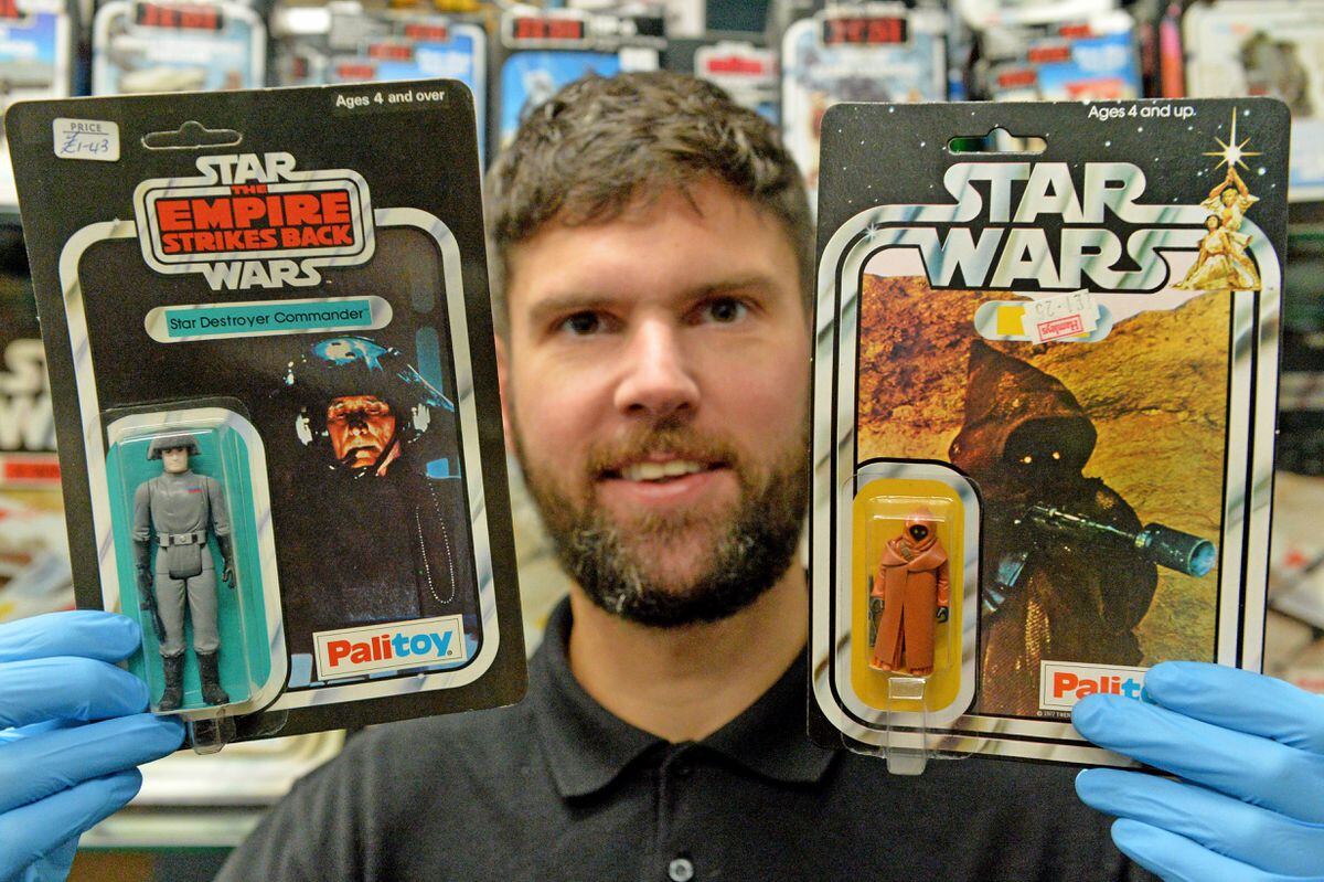 DUDLEY COPYRIGHT TIM STURGESS EXPRESS AND STAR...... 22/10/2020... Astons Auctioneers , Dudley, Star Wars toys auction pre pic this will be the final auction before the new owner takes over. Pictured, Chris Aston with 2  of the rarest figures in the world, left, Stat Destroyer commander on the that card variation there are only three known to exsist, and on the right Jawa with vinyl cape on that card variation there are only 10 in the world and the last one sold  this year for Â£26,000 ! Discovered in a house in Stourbridge..