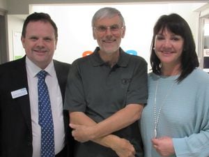 Malcolm Robinson, centre, with cardiologist Dr Derek Connolly and Judy Lewis
