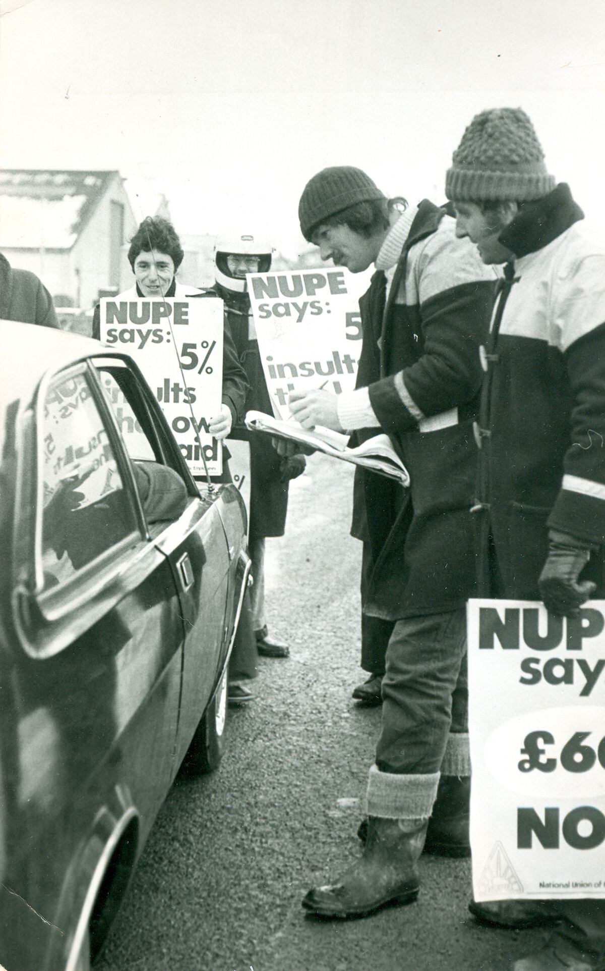 A motorist is confronted by pickets at the highways depot in Longden Road, Shrewsbury, on January 22, 1979