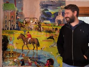 Rob Noddings with the artwork inside his home, in Linley Brook, Bridgnorth, which used to be The Pheasant pub