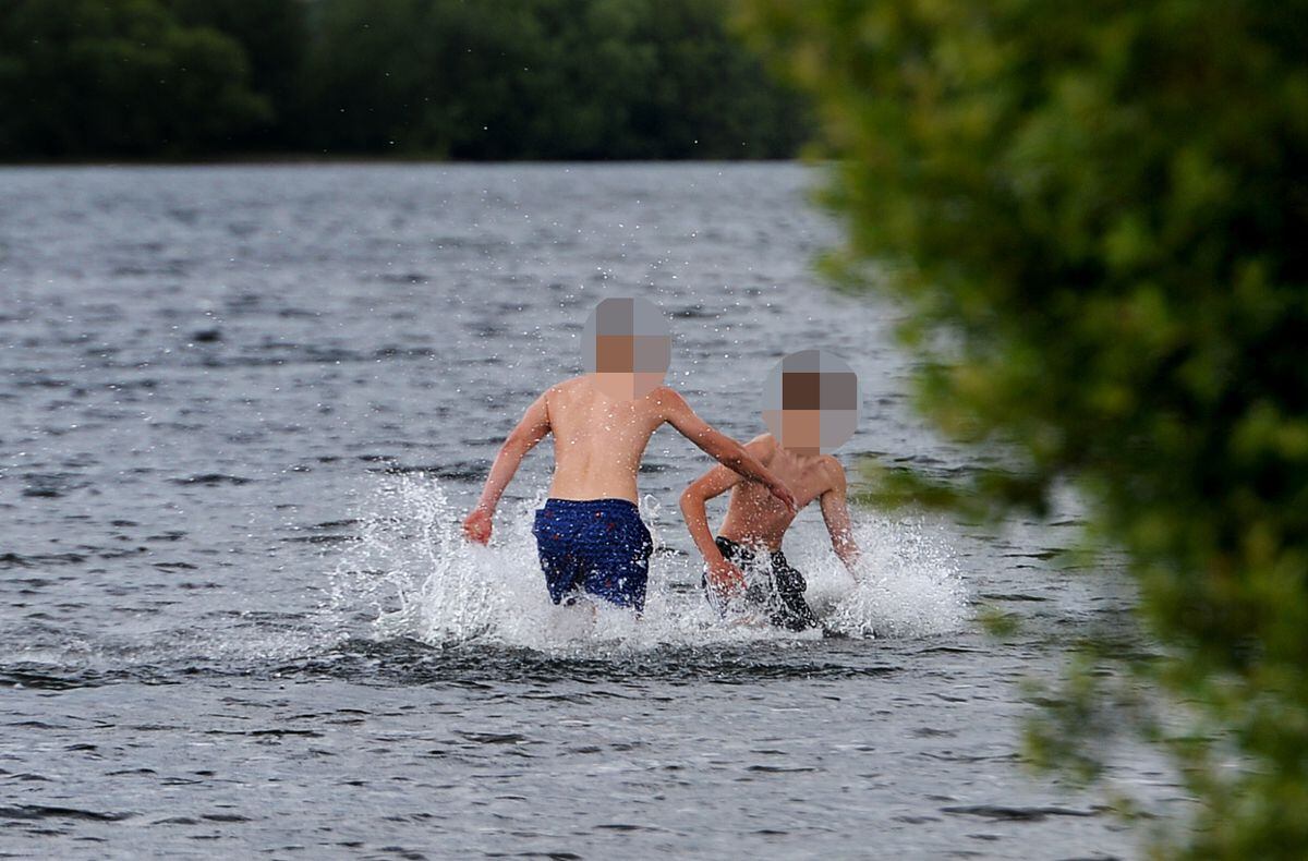 Teenagers in the water at Chasewater on Monday