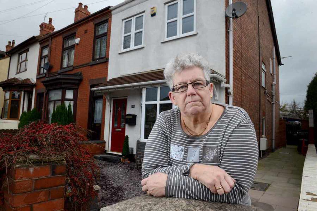 Sue Ridney at the front of her house which was attacked