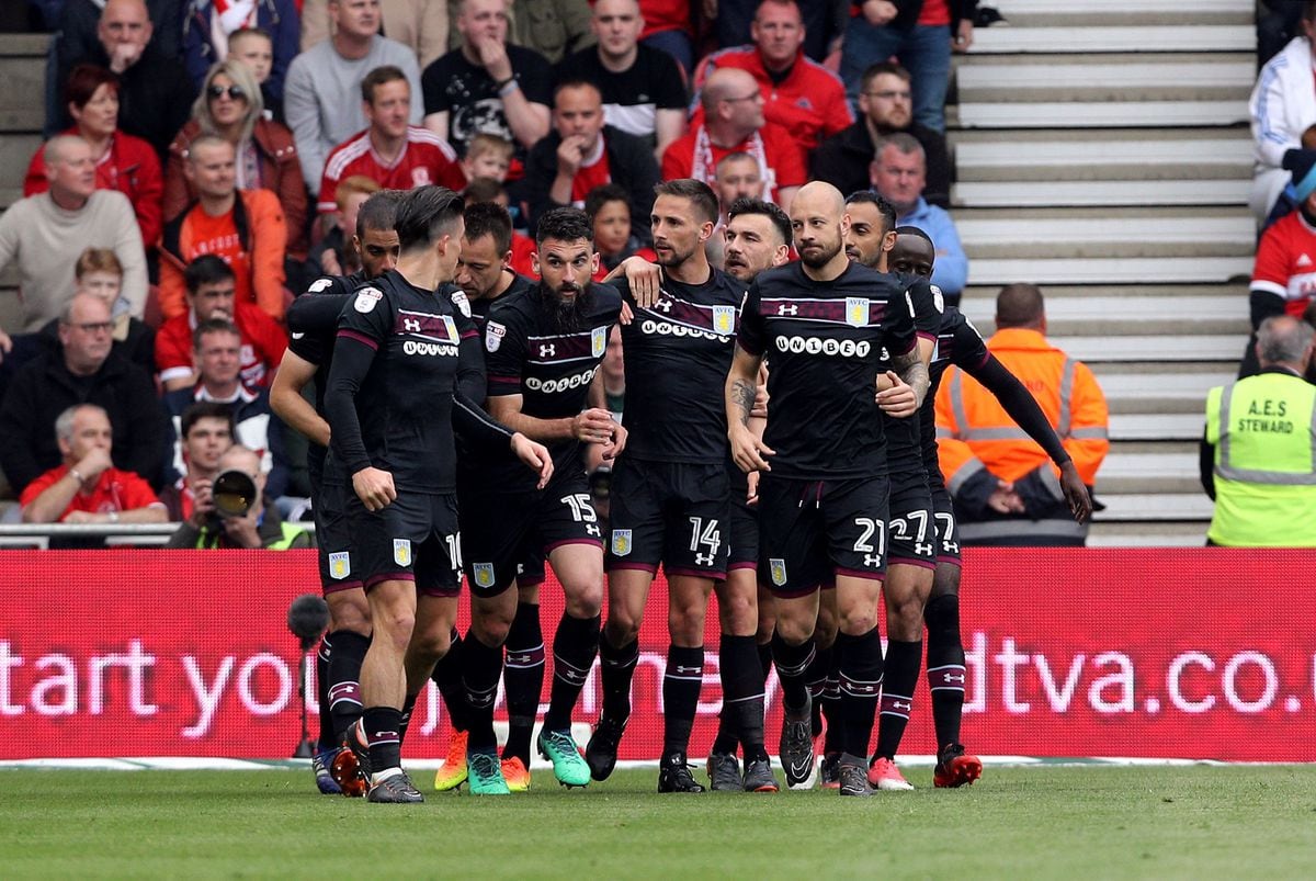 Aston Villa's Mile Jedinak (no.15) celebrates scoring his side's first goal of the game with his team-mates during the Sky Bet Championship Playoff match at the Riverside Stadium, Middlesbrough