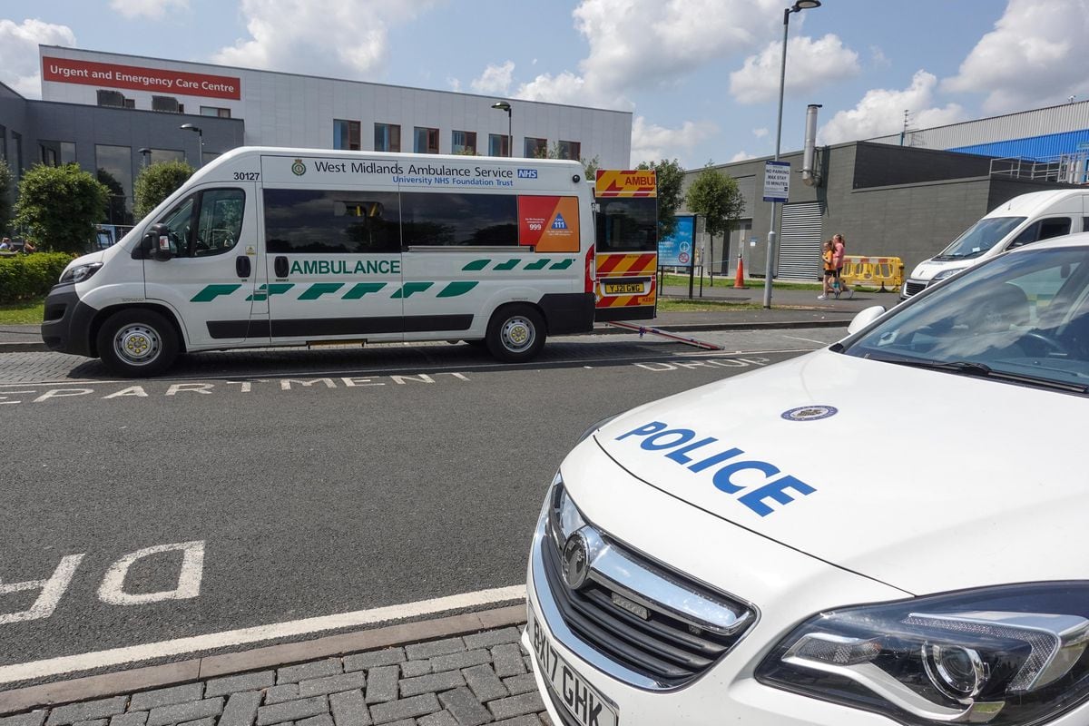 Police at the Emergency Department entrance of New Cross Hospital in Wolverhampton after a member of staff was stabbed. Photo: SnapperSK.
