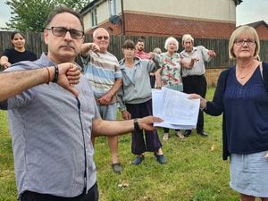 Resident Manoj Prakash and Councillor Diane Coughlan with other residents and a petition against a 5G mast in Clarkes Lane. PIC: Diane Coughlan