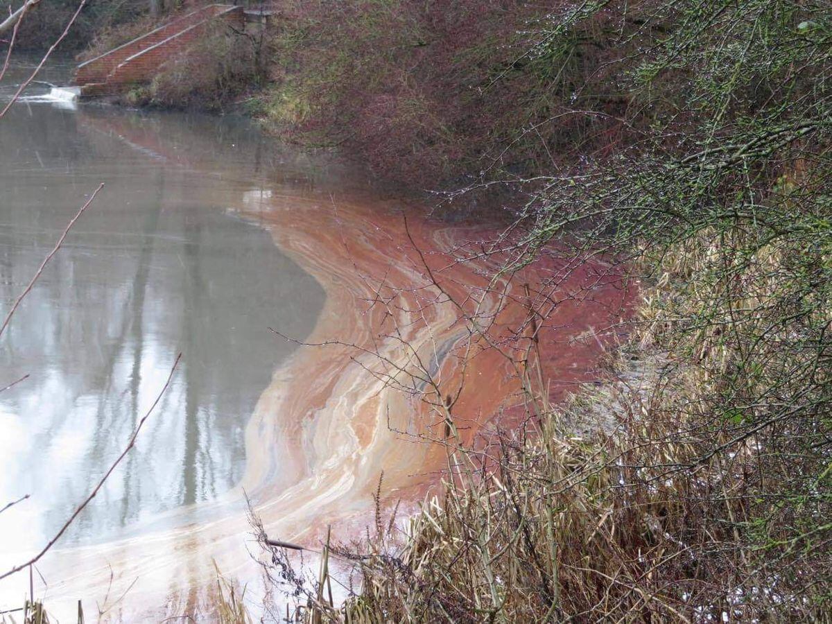 Part of the lake's surface became red from the spillage. Photo: Lisa Reynolds