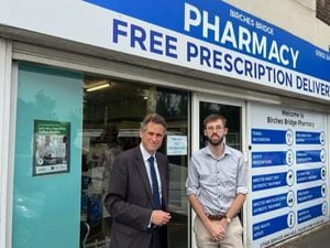 Sir Gavin Williamson with pharmacist James Laycock
