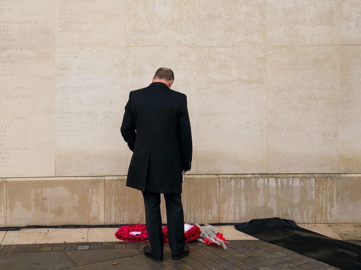 A man observes the Armed Forces Memorial on Armistice Day, at the National Memorial Arboretum, in Alrewas, Staffordshire        