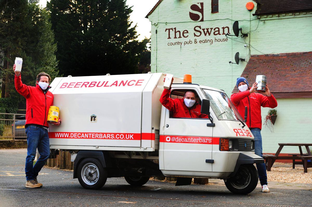 With the Beerbulance, landlord Chris Lowe, centre, and Decanter Bars directors James Hupfield, left, and Max Turner at The Swan