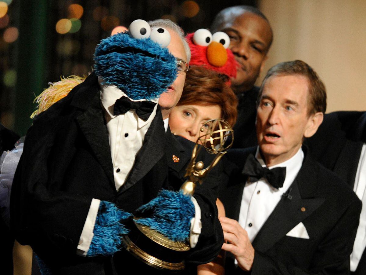 Cookie Monster and Bob McGrath on stage