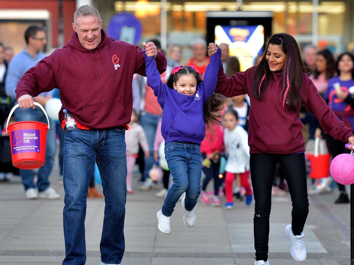 Simon Caulton, partner Anjna Mahey and their inspirational daughter Mia Caulton, aged five, on a fundraising walk in March