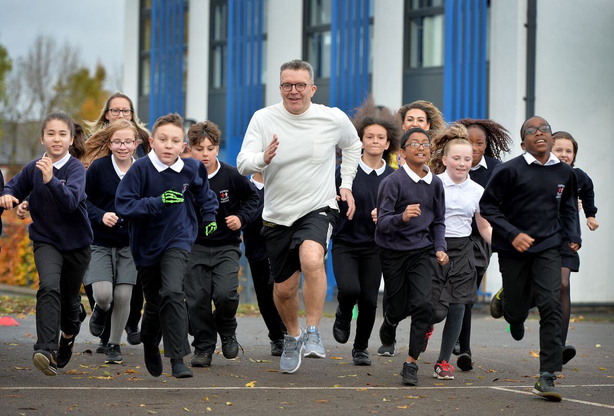 Tom Watson with the children at Hargate Primary School in West Bromwich