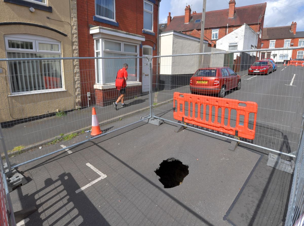 The hole which has appeared in the middle of Brick Kiln Street in Quarry Bank measures six feet deep by 10 feet wide