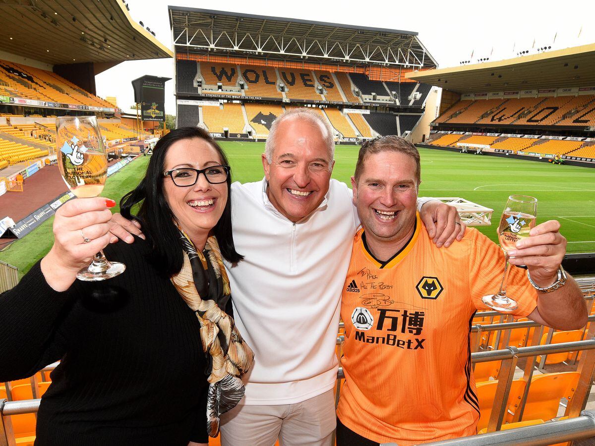 Wolves fan Paul Harrington celebrates his National Lottery Scratchcard win with girlfriend Julie Hulett and Steve Bull