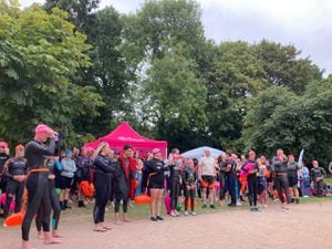 Swimmers wait to take the plunge in the mere
