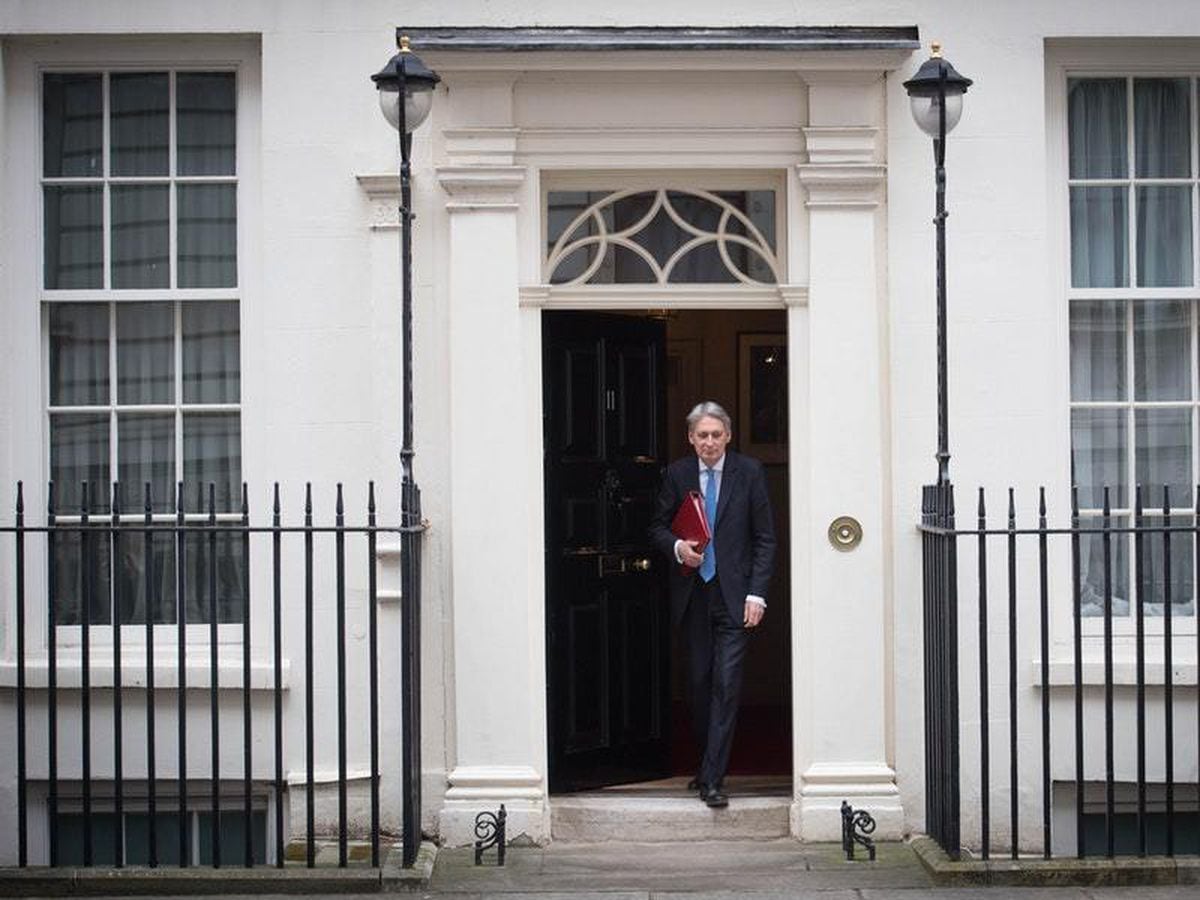 Mr Hammond delivered his speech against a slew of positive economic indicators (Stefan Rousseau/PA)