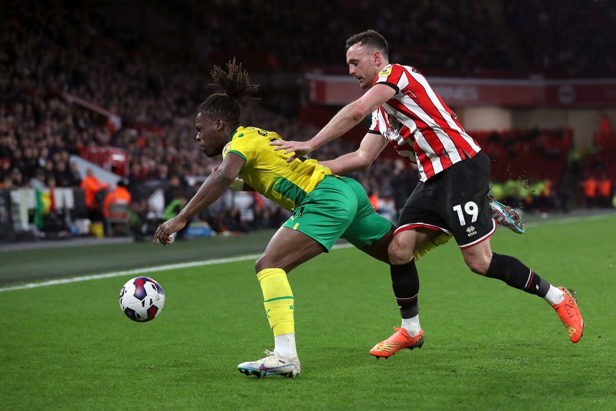 Jack Robinson of Sheffield United pushes Brandon Thomas-Asante of West Bromwich Albion (Photo by Adam Fradgley/West Bromwich Albion FC via Getty Images).