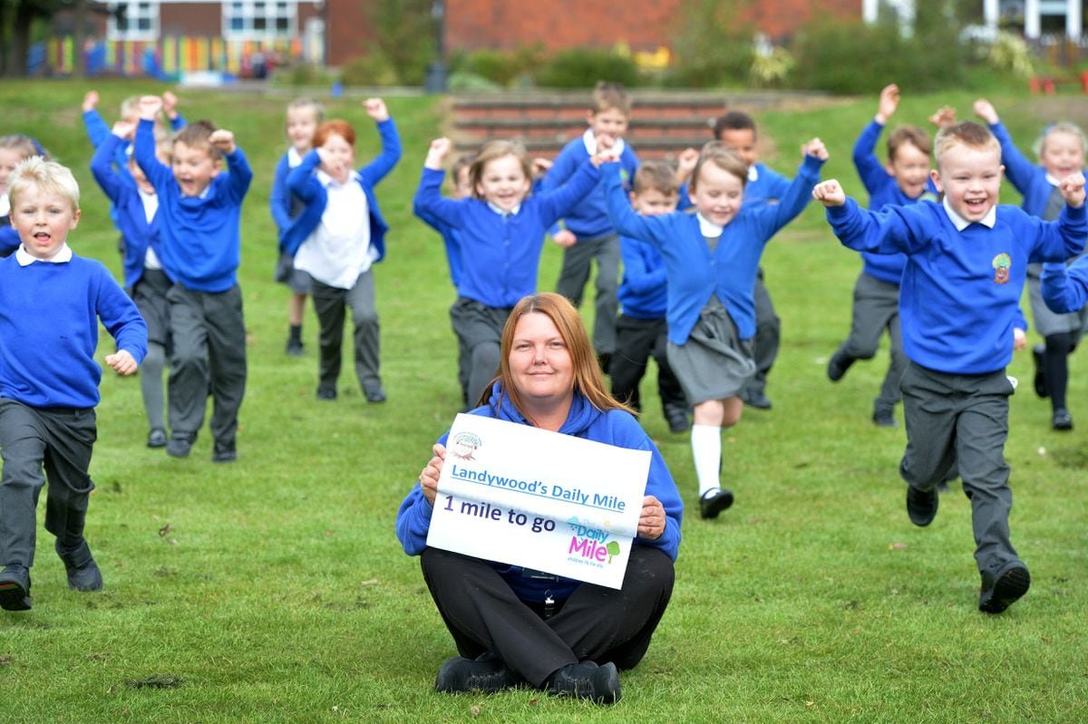 Teaching assistant Sarah Timms leads pupils at Landywood Primary School in Great Wyrley forward on their Daily Mile