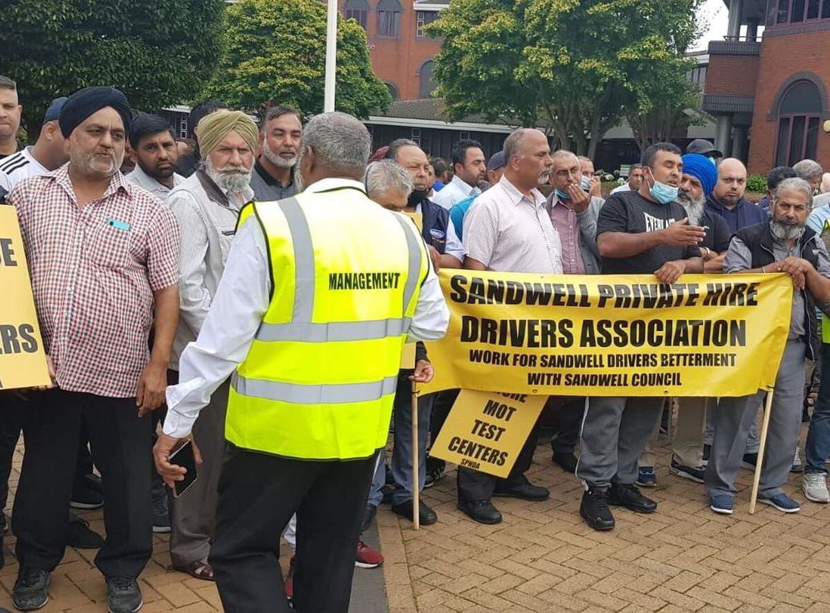 Sandwell taxi drivers gather outside Sandwell Council House, Oldbury, to protest long delays when acquiring private hire licences, in August 2021