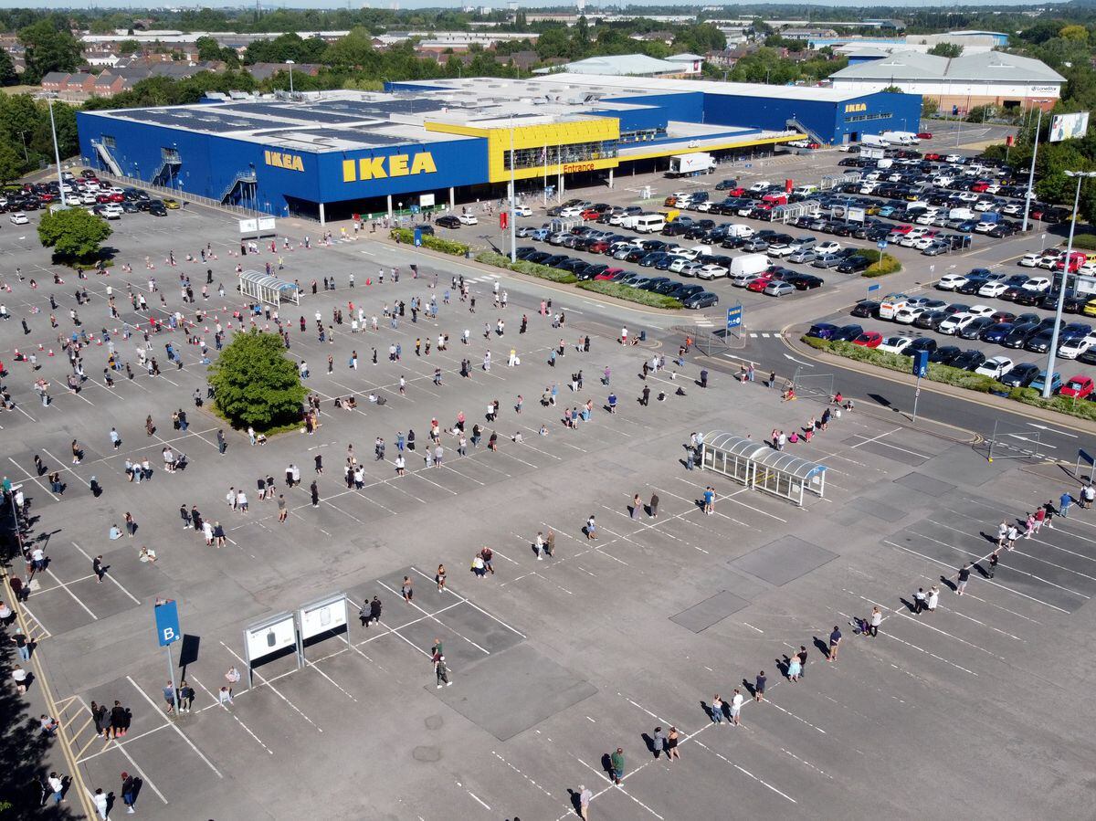 This huge queue snakes along the car park as people await the reopening of Ikea off the M6 today. Image: Tim Thursfield/Express & Star