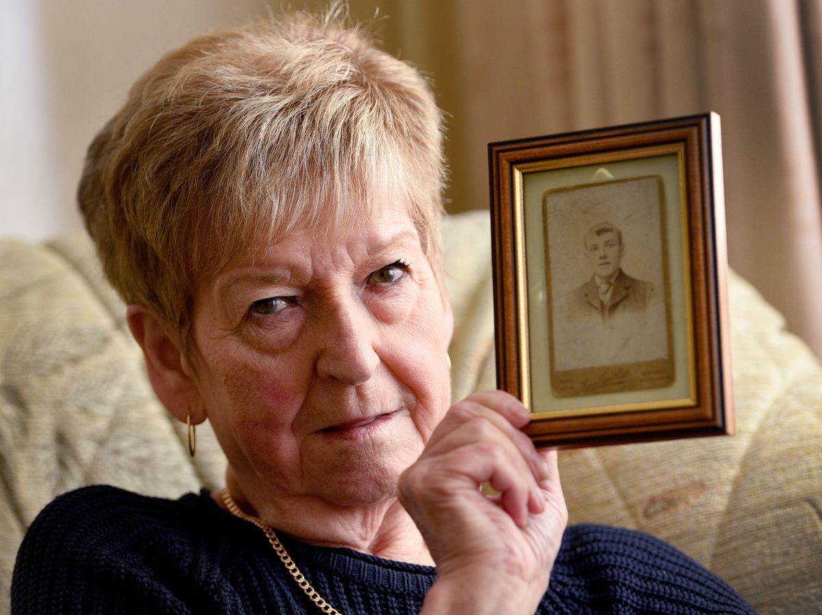 Iris Archer with a picture of her grandfather Benjamin Shepherd
