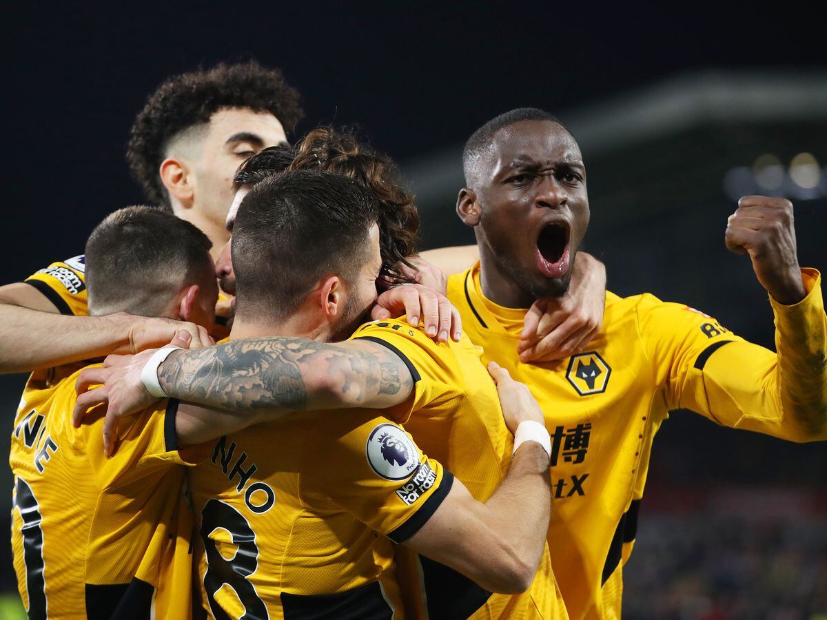 Ruben Neves of Wolverhampton Wanderers celebrates with Toti Gomes and team mates (Photo by Jack Thomas - WWFC/Wolves via Getty Images).