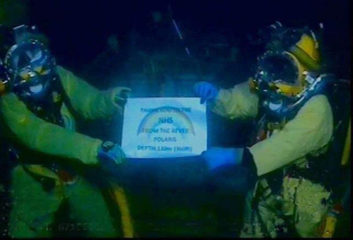 RMT divers with NHS sign