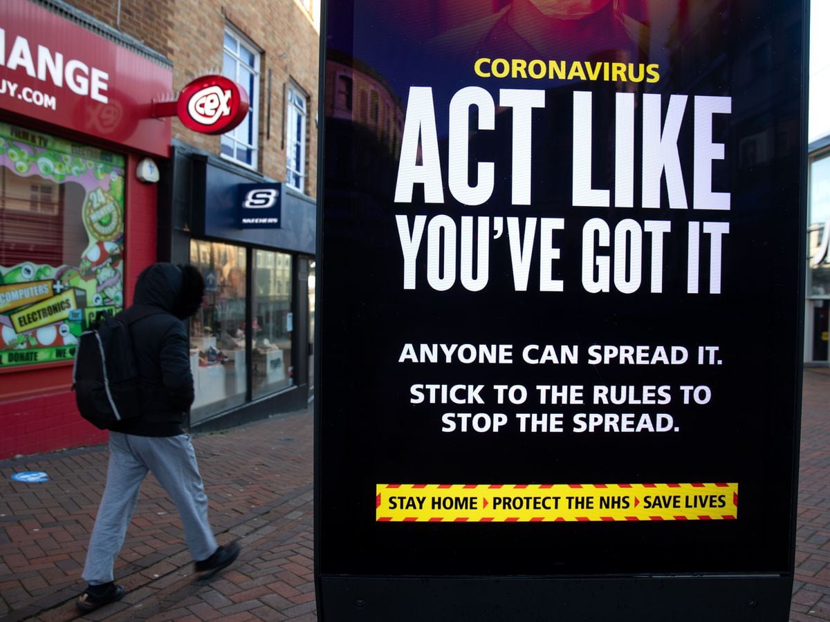 Coronavirus warning sign on high street
