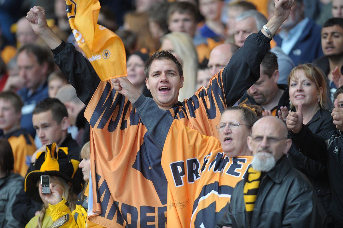 Wolves fans celebrate their Premiership survival.