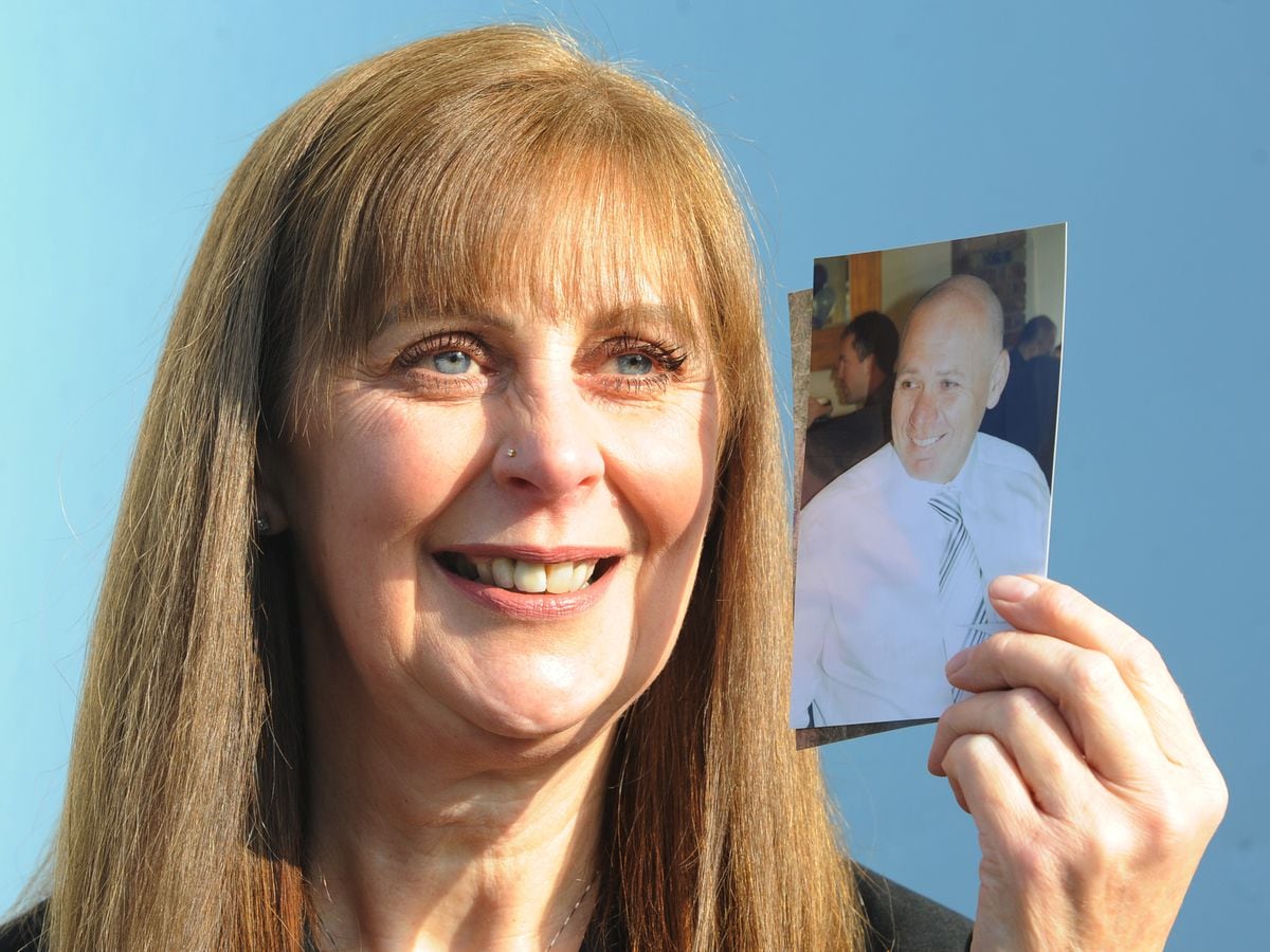 Margaret Kelsall with a photograph of her husband of 33 years