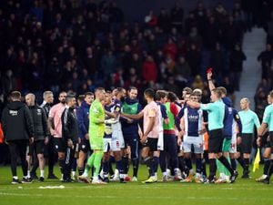 West Bromwich Albion goalkeeper Sam Johnstone (In green) is shown a red card  PA