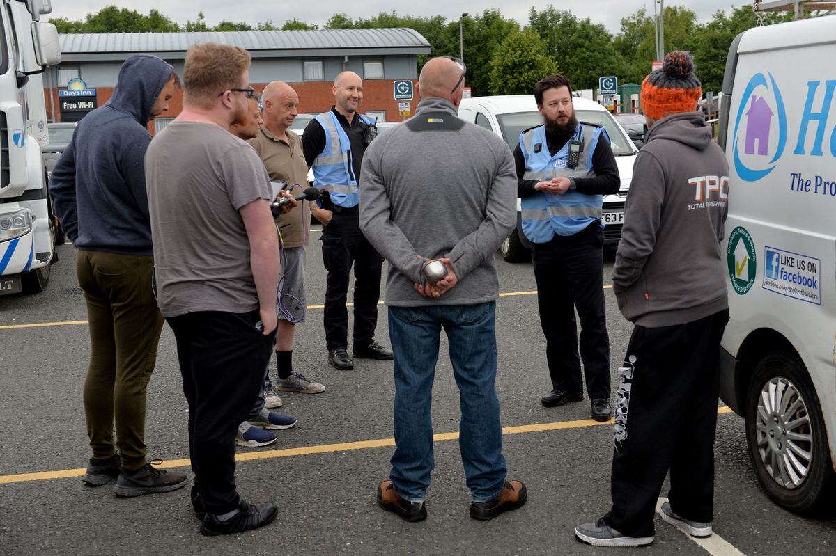 Police talk with protestors at Telford Services