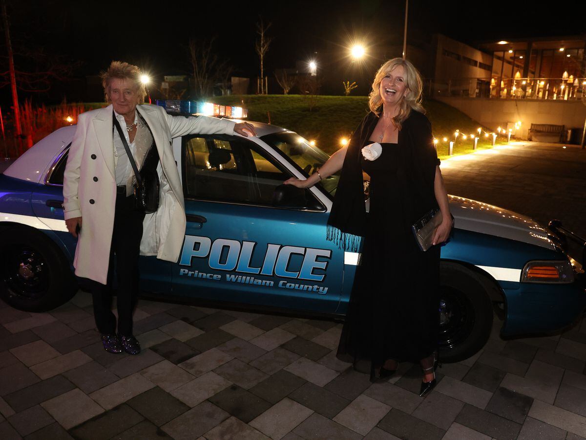Penny Lancaster, COPS patron, pictured with her husband Sir Rod Stewart CBE with the donated US police car