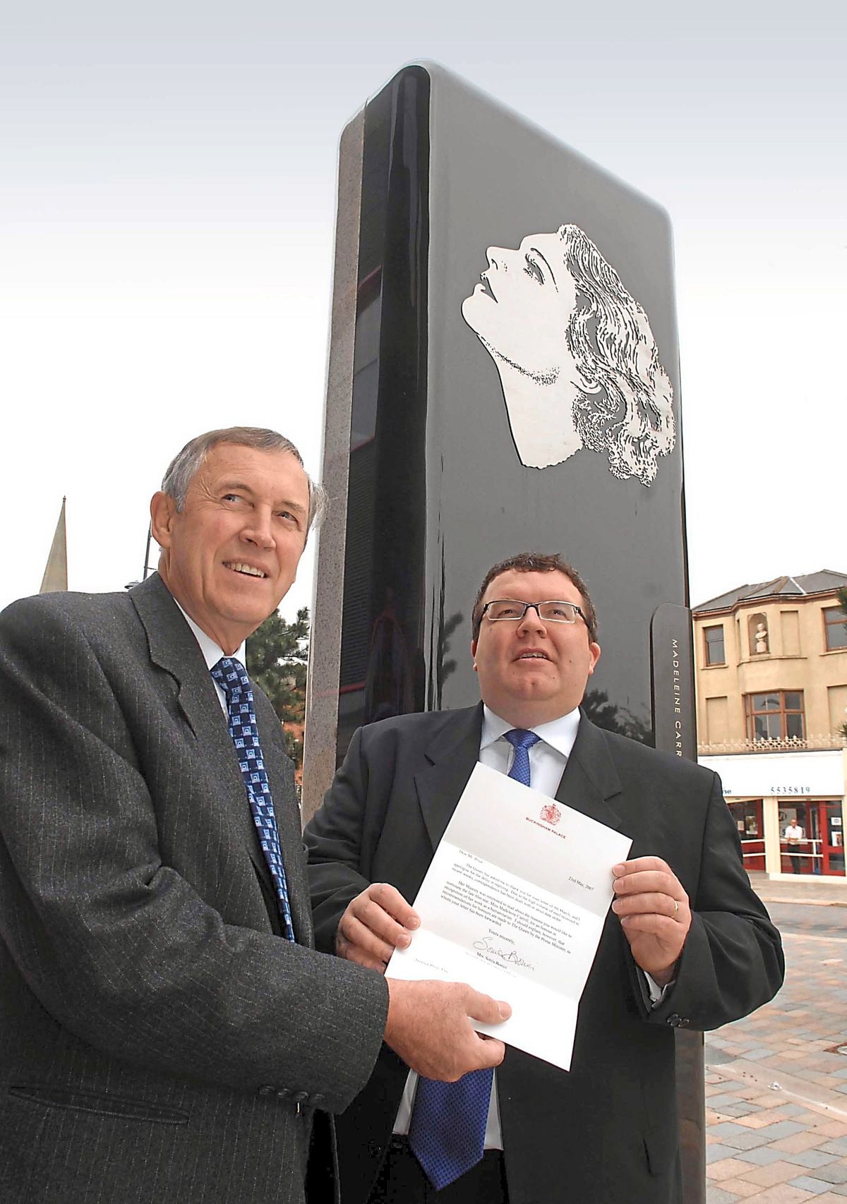 Historian Terry Price and former MP Tom Watson at the monument to Madeleine Carroll in West Bromwich town centre